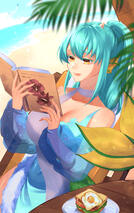 Image of Nixie reading a book on a beach.